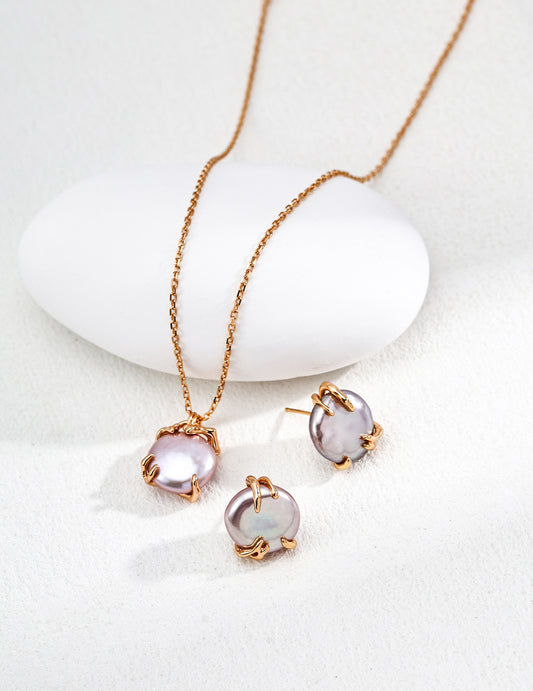 Gold-tone pendant necklace with lavender Edison pearl and two matching stud earrings