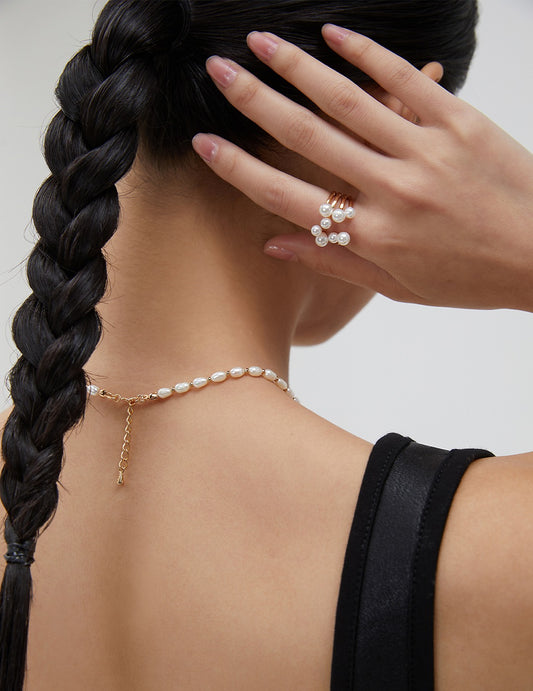 Sterling silver pearl blossom ring with clustered white pearls on ribbed band