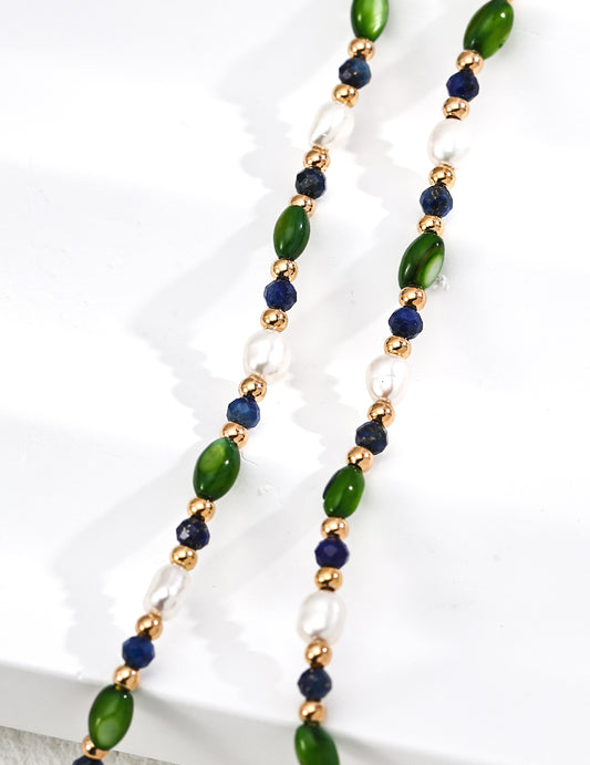 Bead pearl necklace strands with green oval beads, navy beads, gold accents and pearls