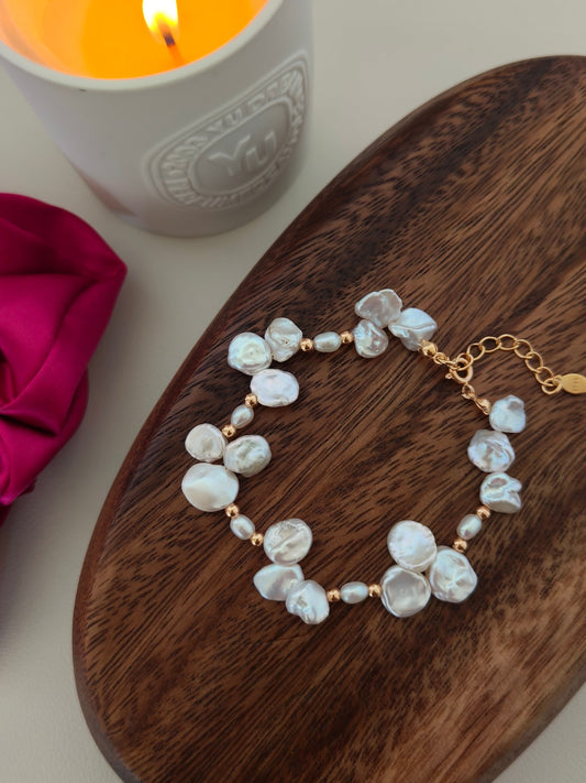 Freshwater pearl bracelet with sculpted baroque pearls and gold-tone chain links