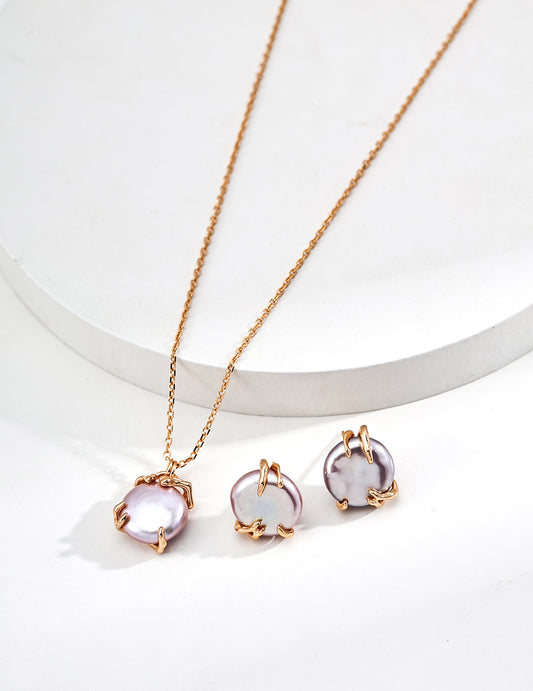 Gold-tone pendant necklace with lavender Edison pearl, paired with matching stud earrings