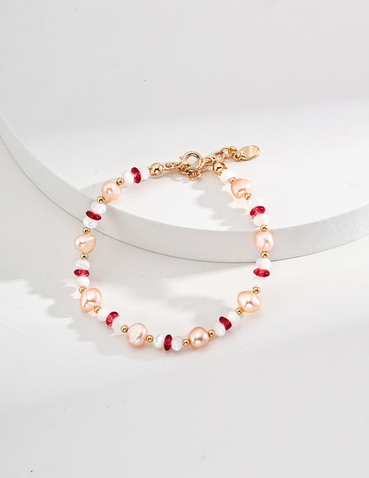 Pink pearl and red bead beaded bracelet with gold-tone ring clasp