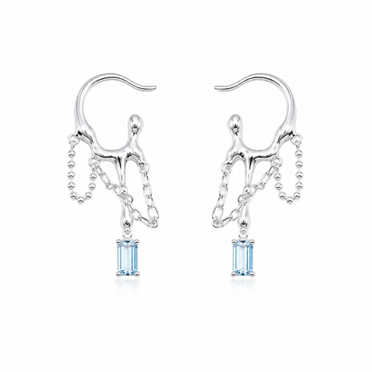 Silver-tone drop earrings with blue square stones and dangling chain accents