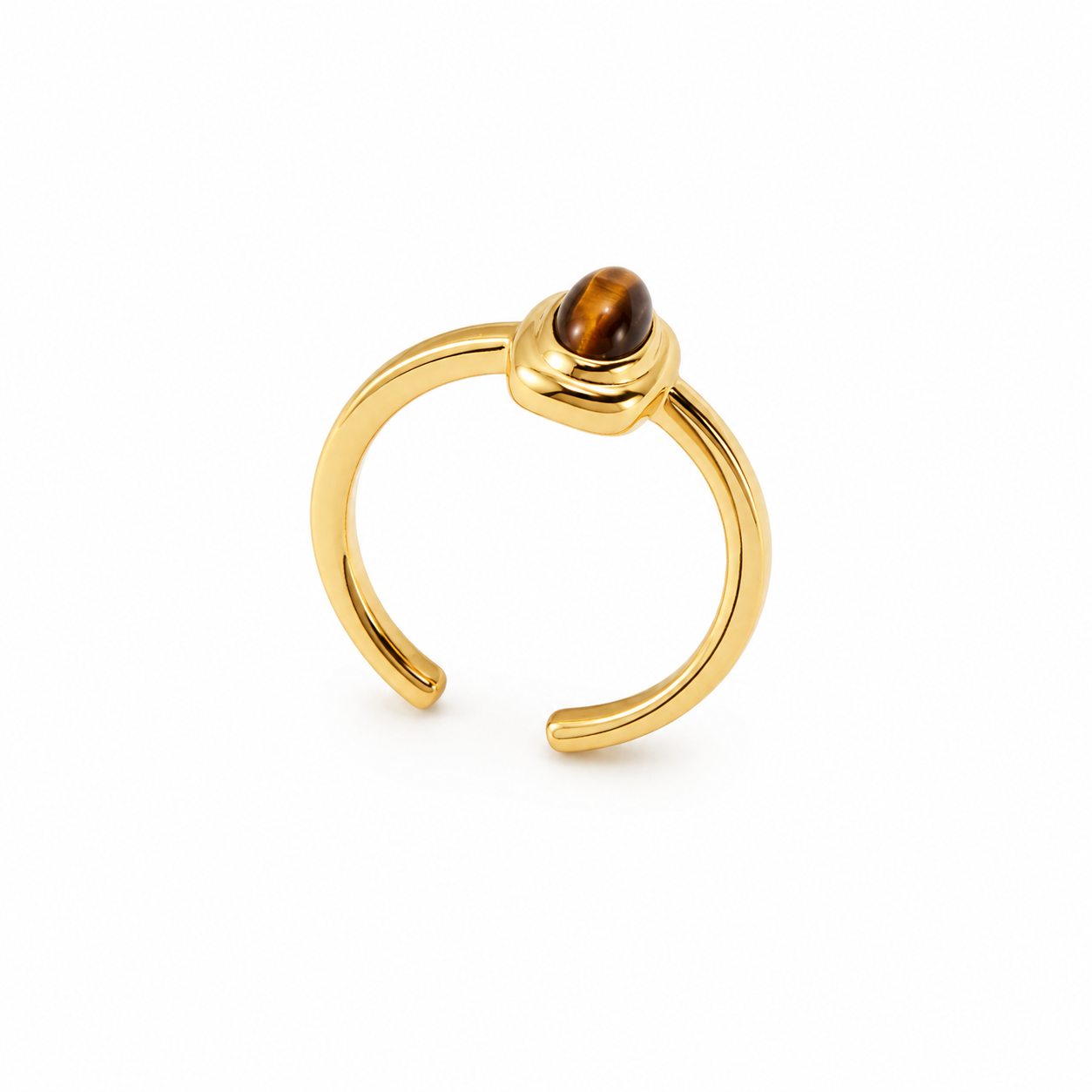 Gold-tone ring with round tiger eye cabochon bezel setting, open band