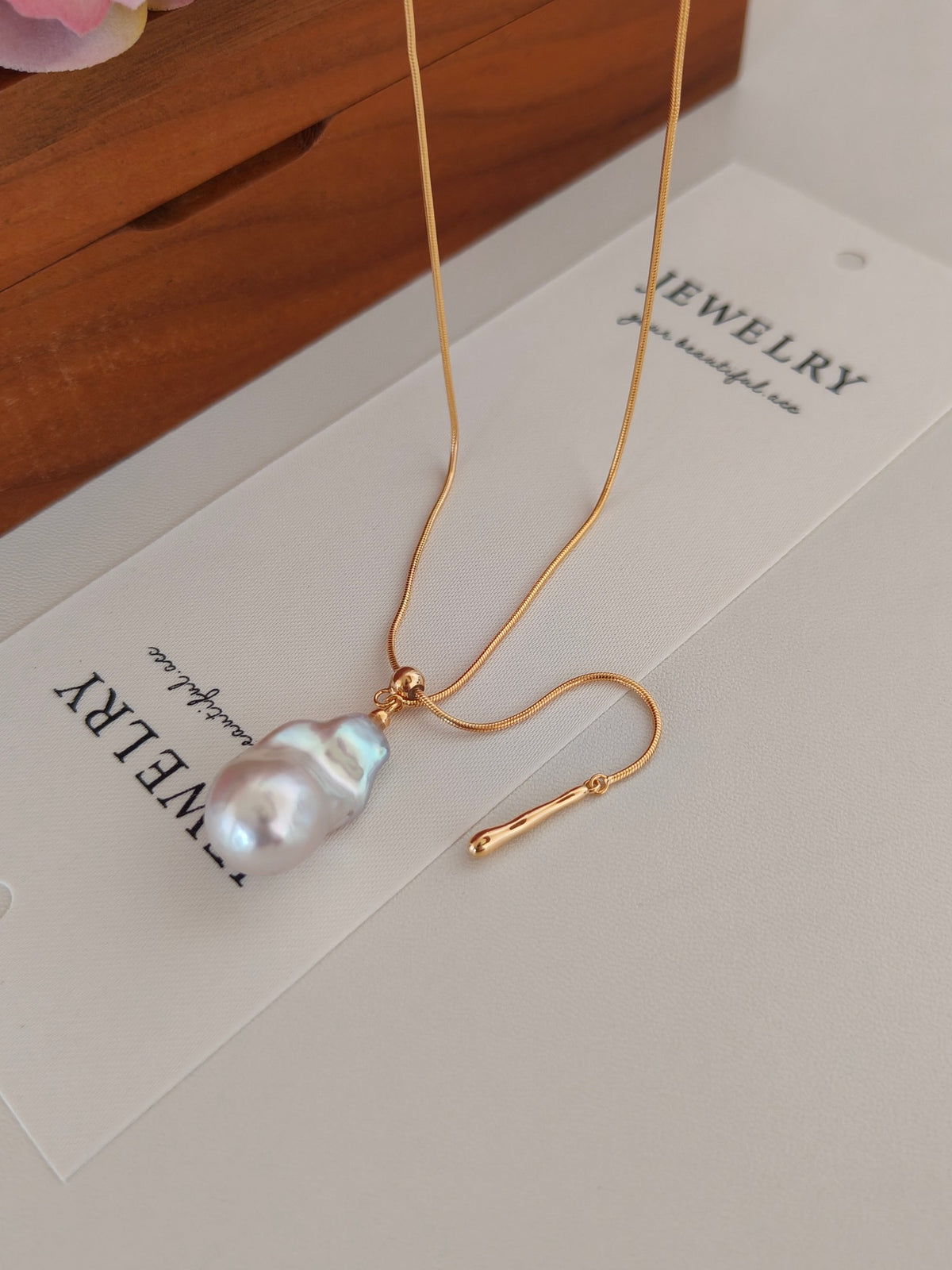 Gold baroque pearl pendant necklace with adjustable chain and long tassel drop