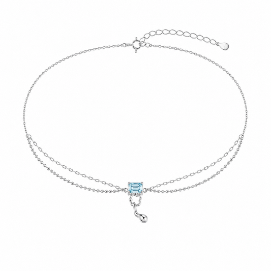 Silver chain necklace with light blue square gemstone and small drop charm