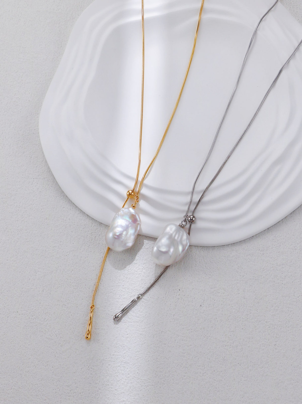 Gold and silver adjustable baroque pearl pendant necklaces with tassel drops
