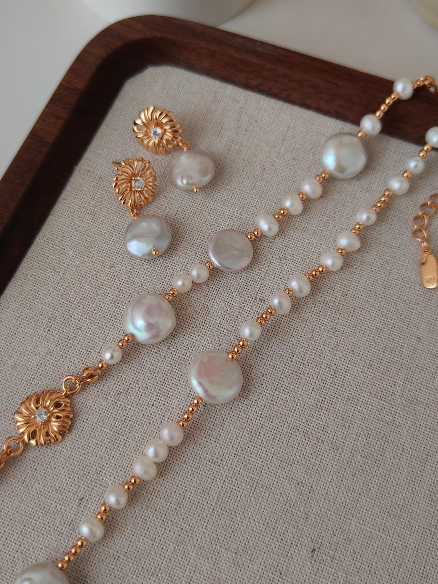 Freshwater pearl necklace with gold floral charms and pearl bead strands