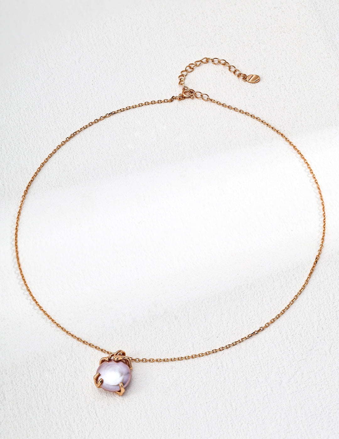 Lavender Edison pearl pendant on gold-tone chain with small clasp tab