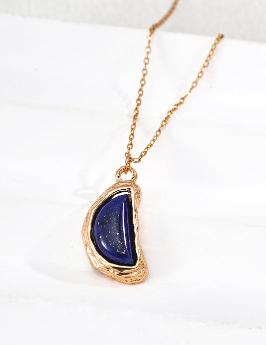 Gold-tone teardrop lapis pendant necklace, front view with hanging chain