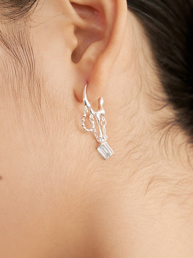Silver-tone hoop earrings with blue rectangular drops and dangling chain