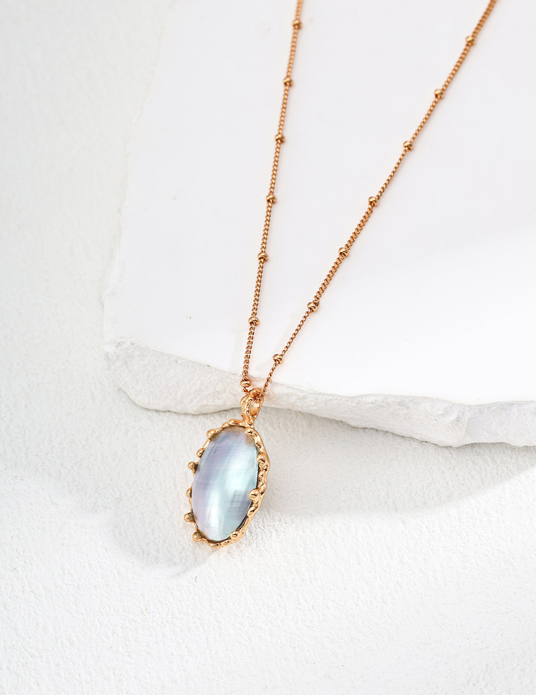 Mabe pearl pendant necklace with oval blue mabe pearl and gold-tone chain