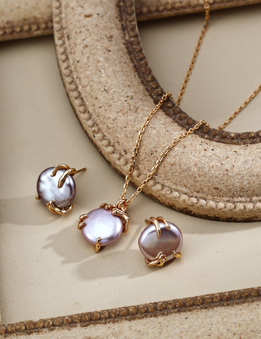 Gold-tone pendant necklace with lavender Edison pearl plus three matching stud earrings