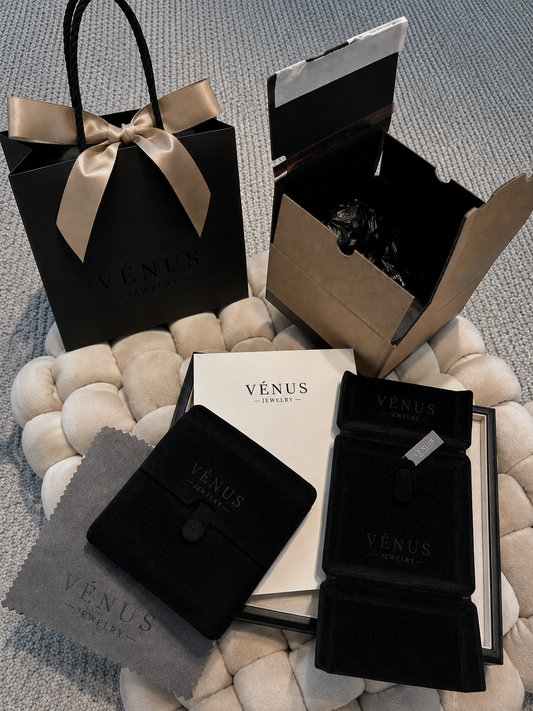 Luxury gift packing set with black gift bag, ribbon, and black jewelry boxes