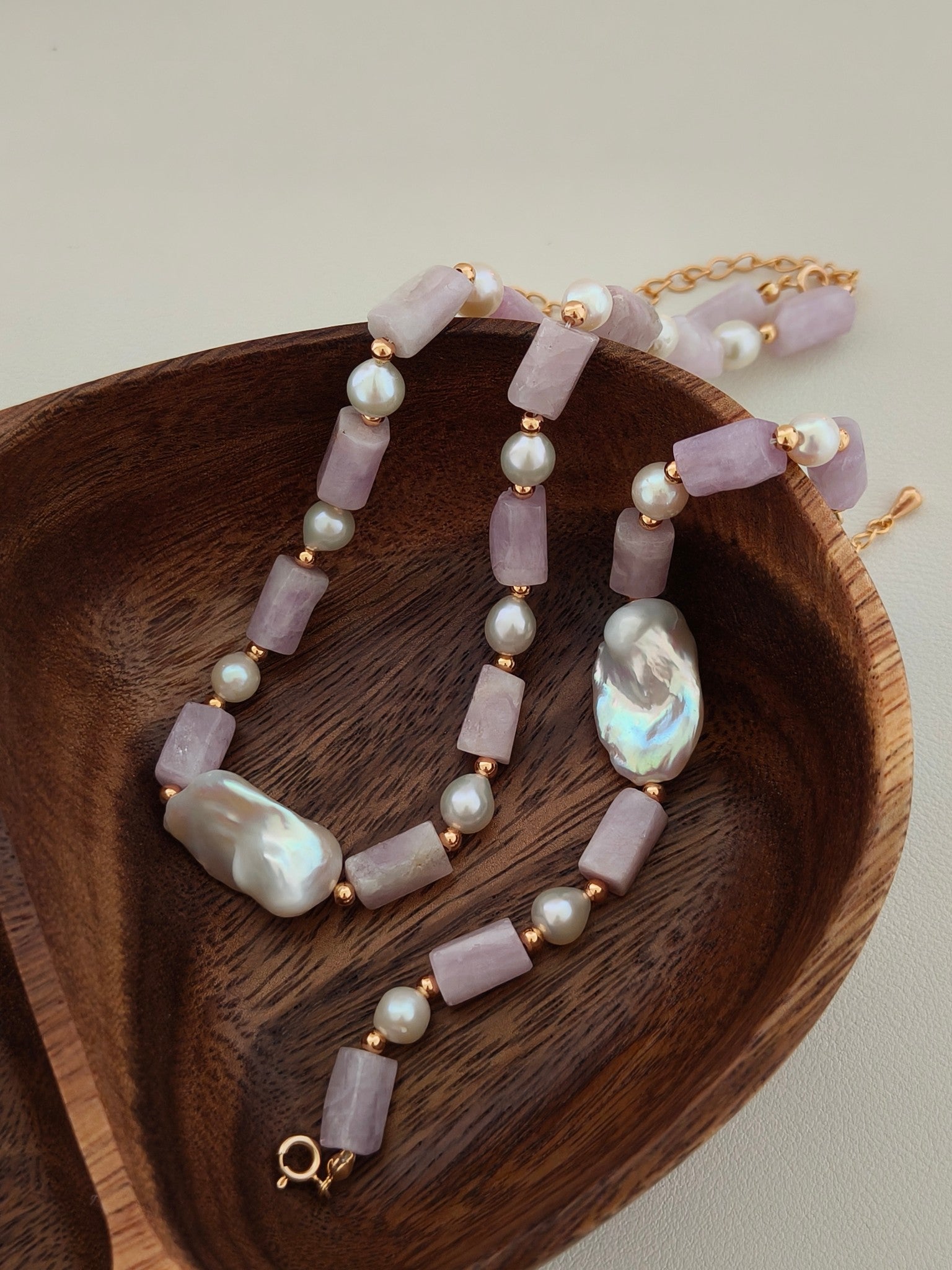 Baroque pearl and kunzite necklace with lavender stone bars, white pearls, and large iridescent pearls