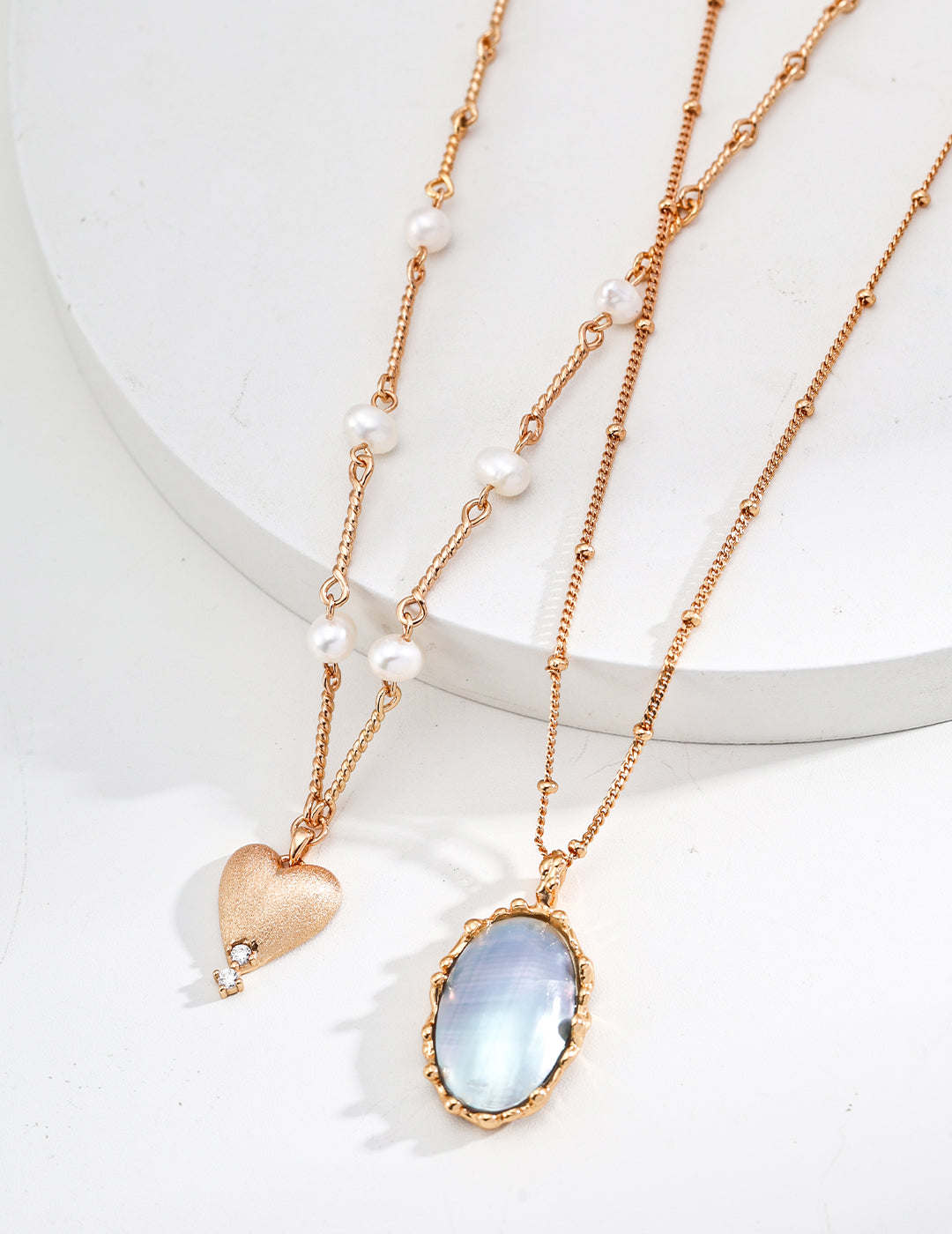 Mabe pearl pendant necklace with oval blue pearl pendant on gold-tone link chain