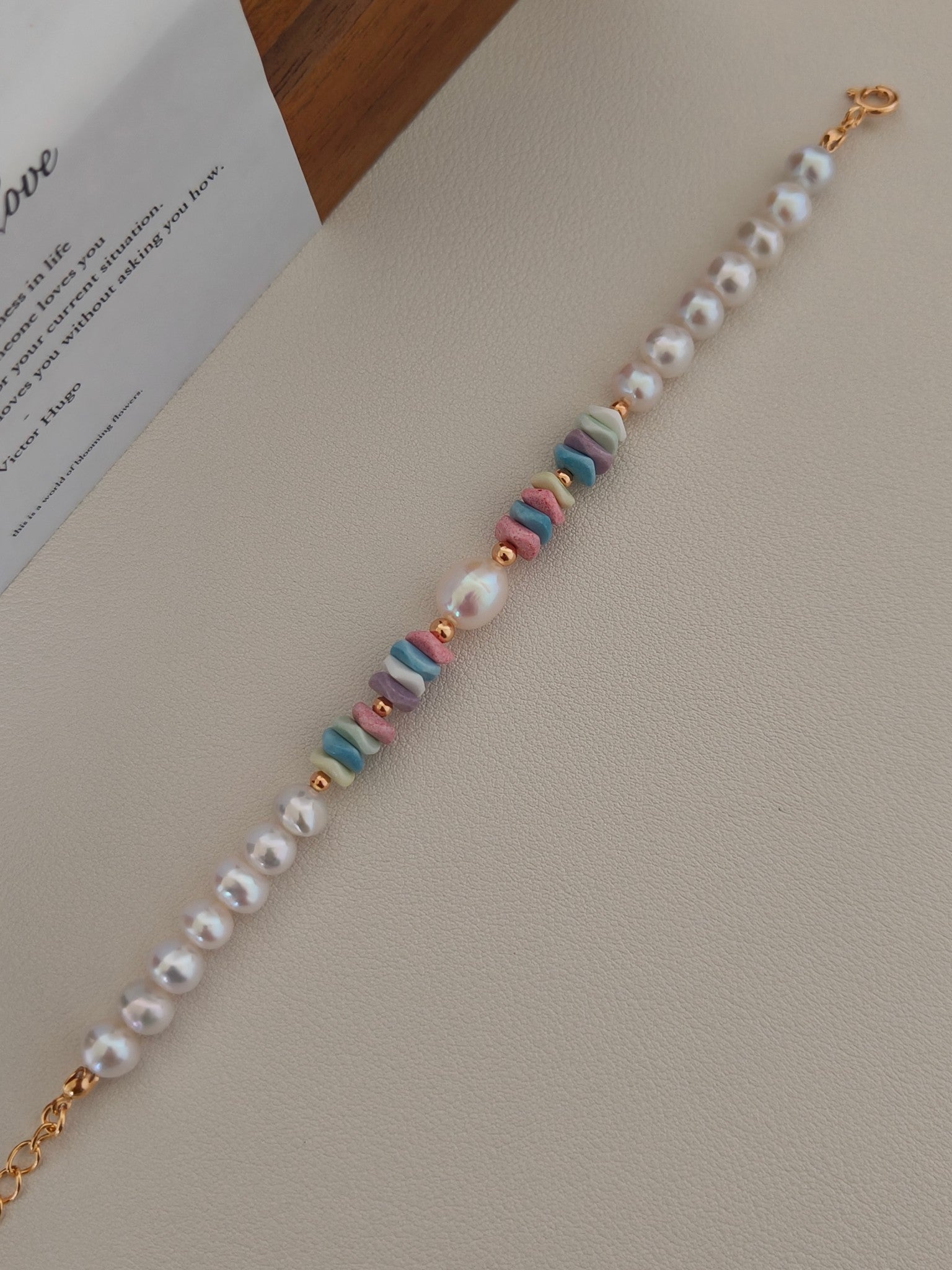 Freshwater pearl bracelet close-up with pastel stone beads along the strand