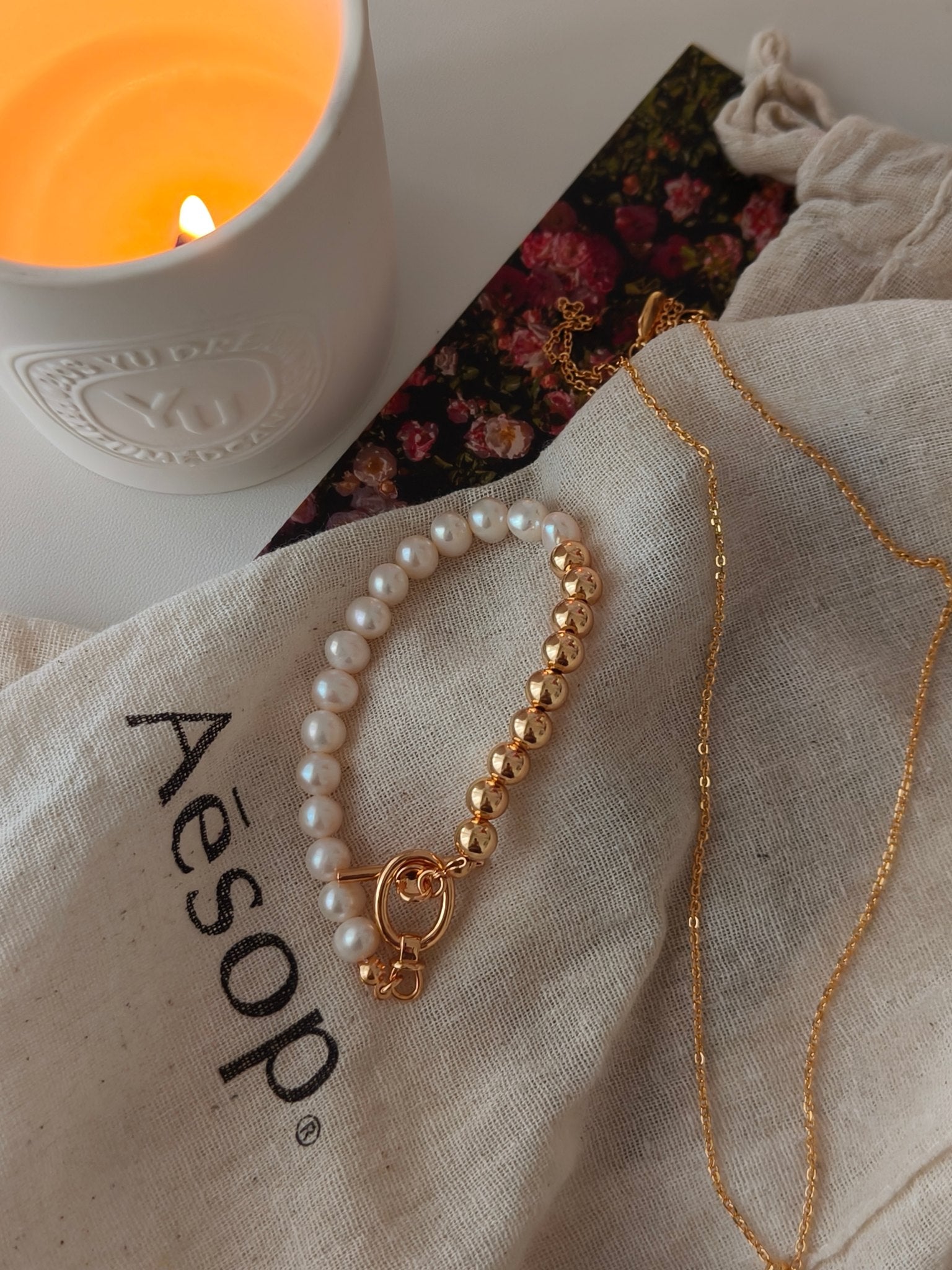Freshwater pearl bracelet with white pearls, gold bead chain, and round clasp ring