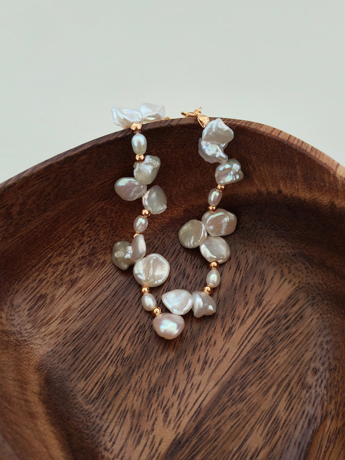 Freshwater pearl bracelet with irregular heart-like baroque pearls and gold-tone fittings
