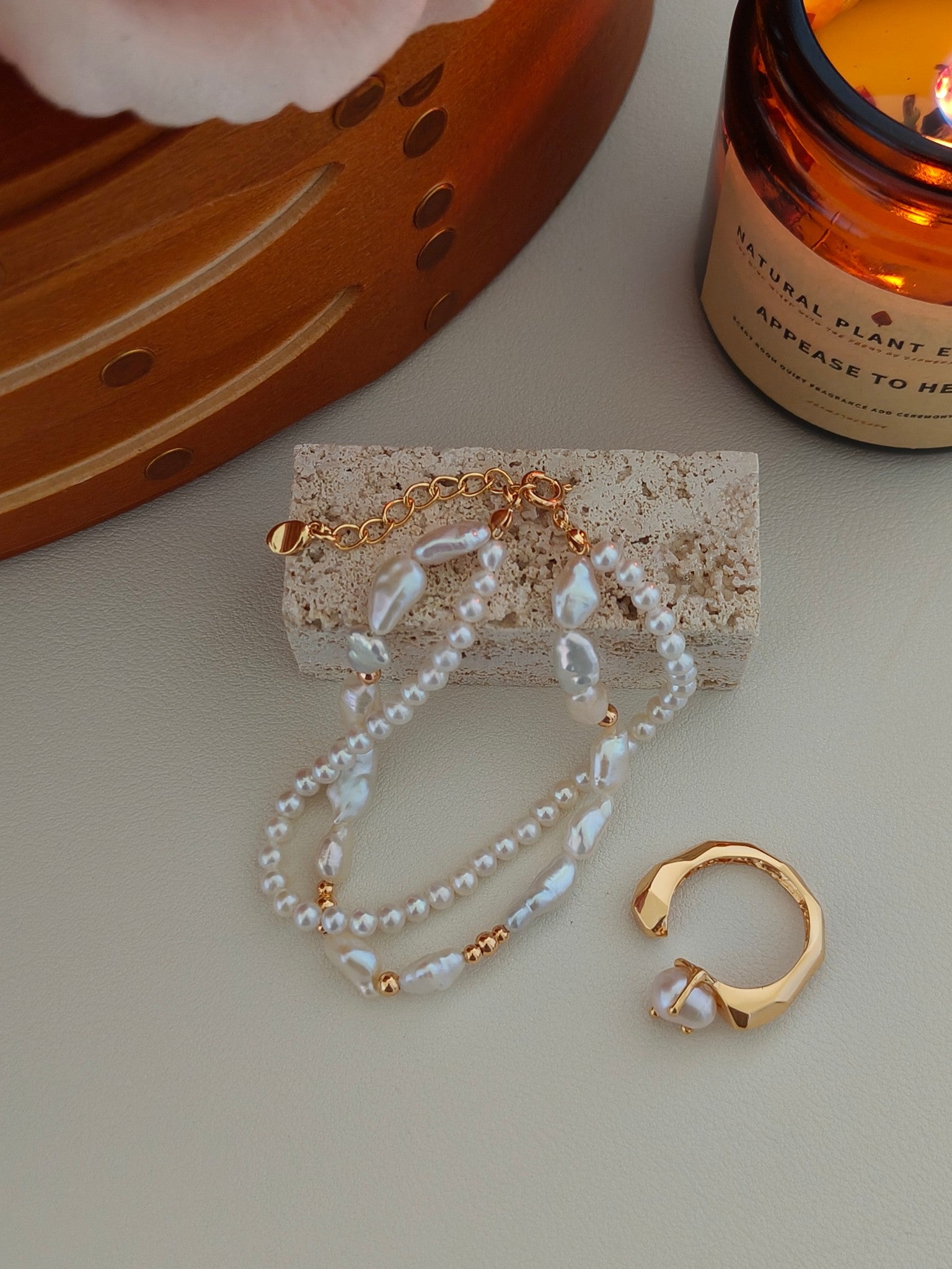 Pearl bracelet with layered strands of baroque freshwater pearls and gold-tone chain
