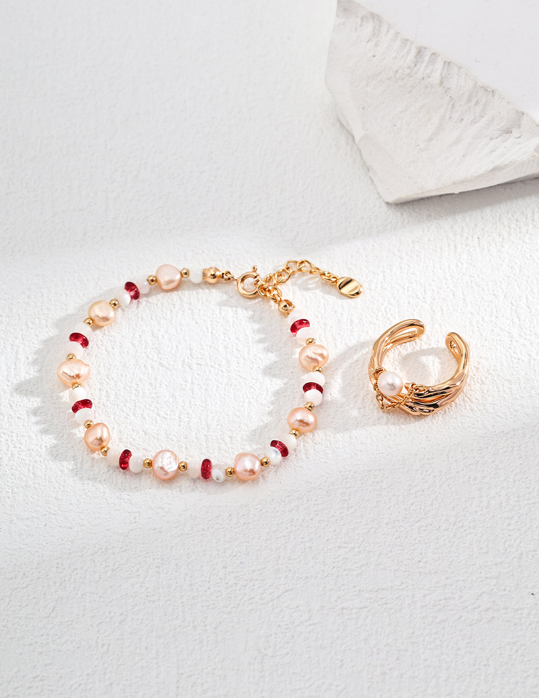 Pink pearl and red bead beaded bracelet with gold-tone clasp and chain