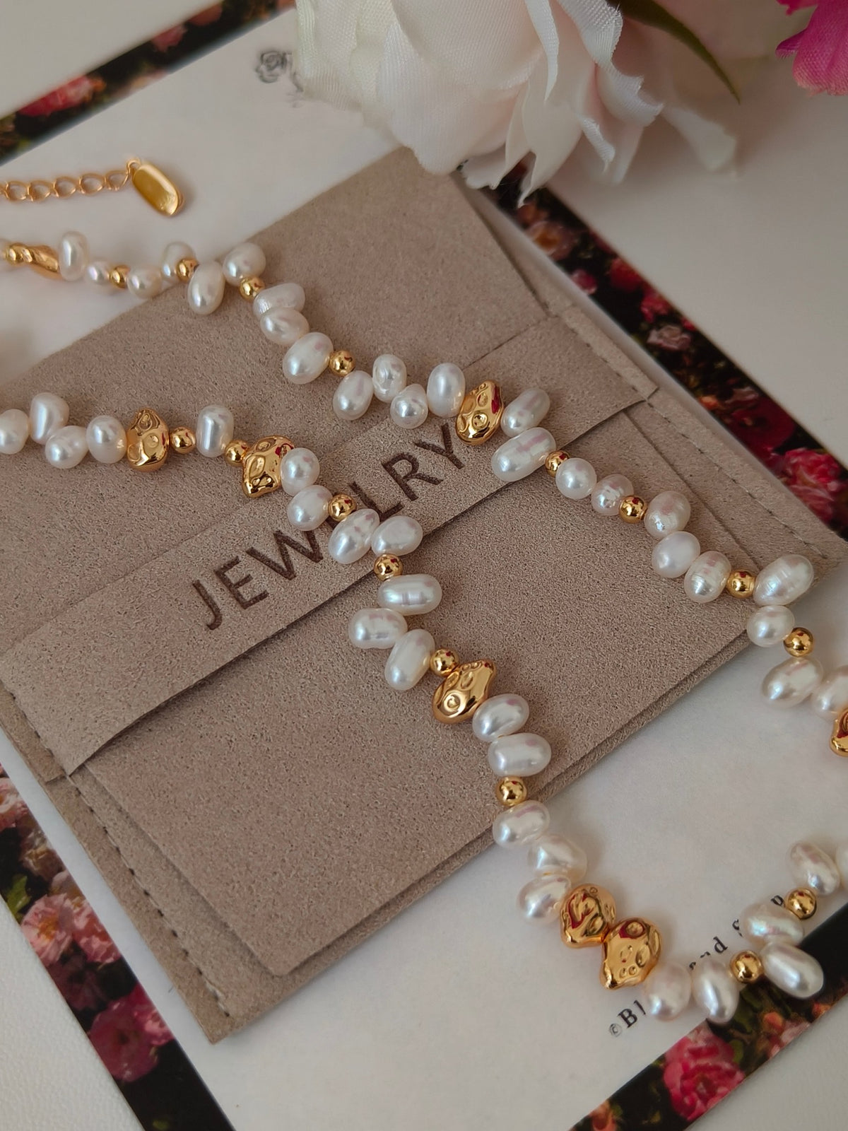 Freshwater pearl jewelry set with gold-tone charm and heart clasp on card
