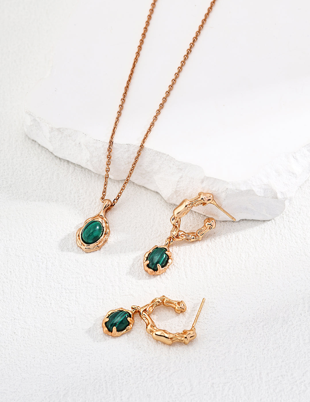 Gold-tone set with green oval pendant necklace and matching stud and hoop earrings