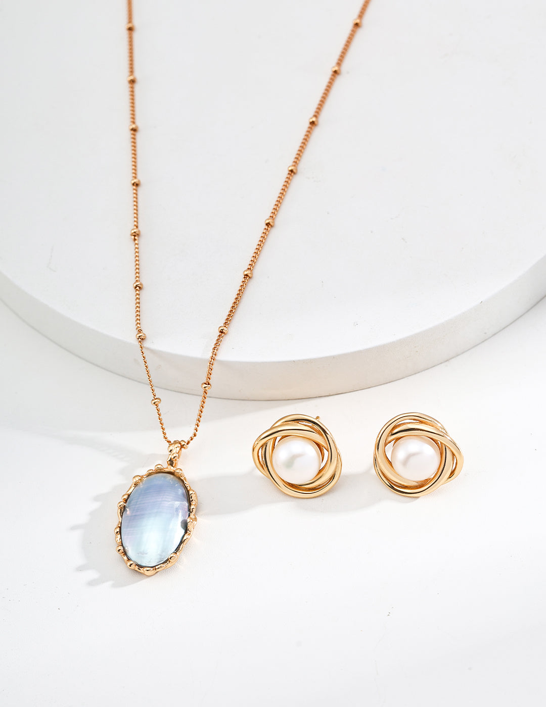 Mabe pearl pendant necklace showing oval blue pearl pendant and gold-tone chain