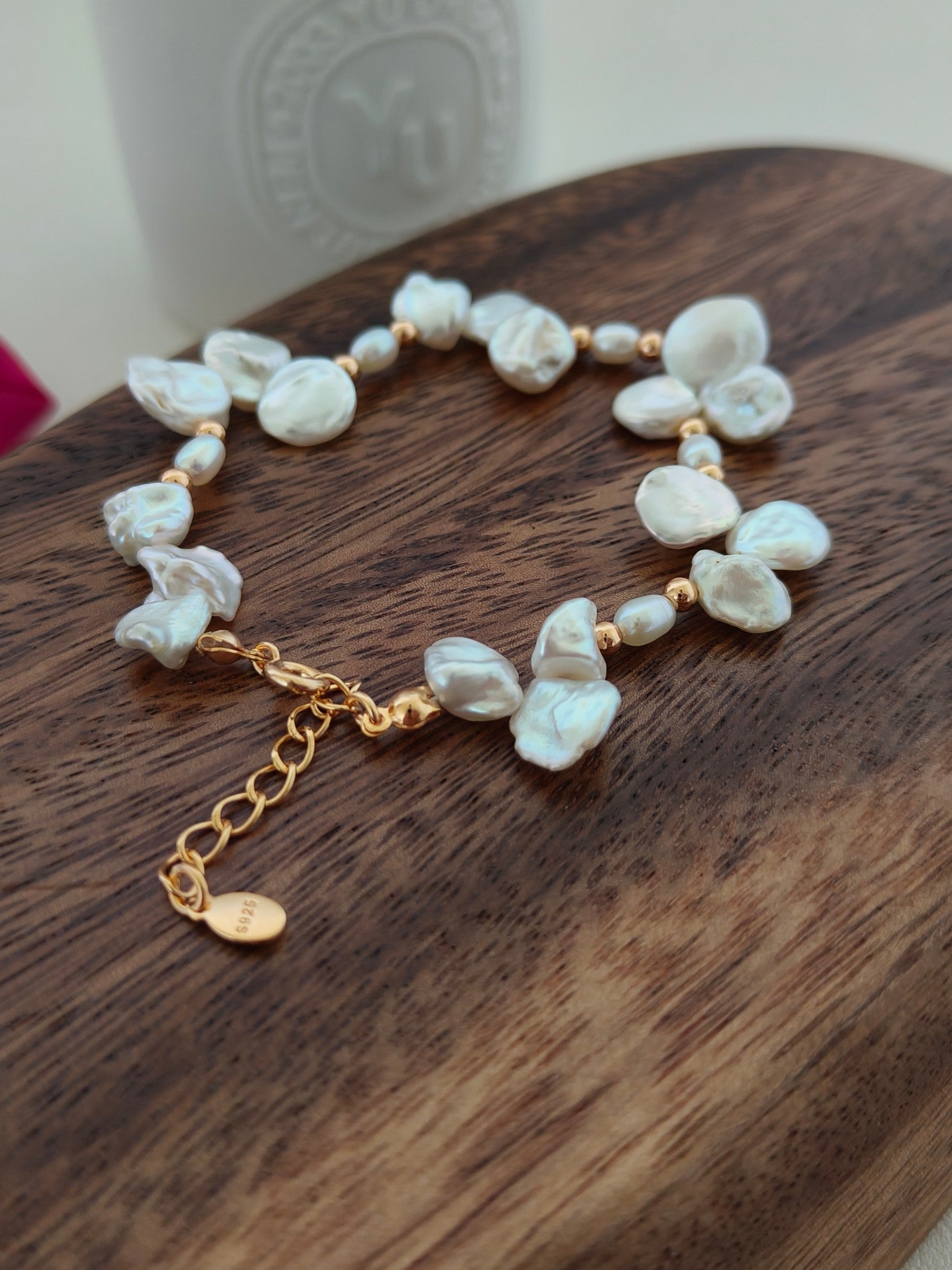 Freshwater pearl bracelet with flowing baroque pearl shapes and gold-tone lobster clasp