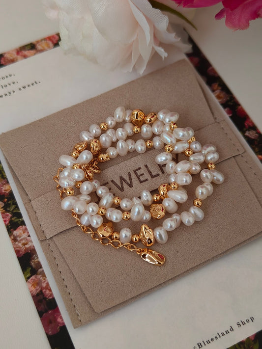 Freshwater pearl bracelet-style necklace with gold-tone heart pendant on card
