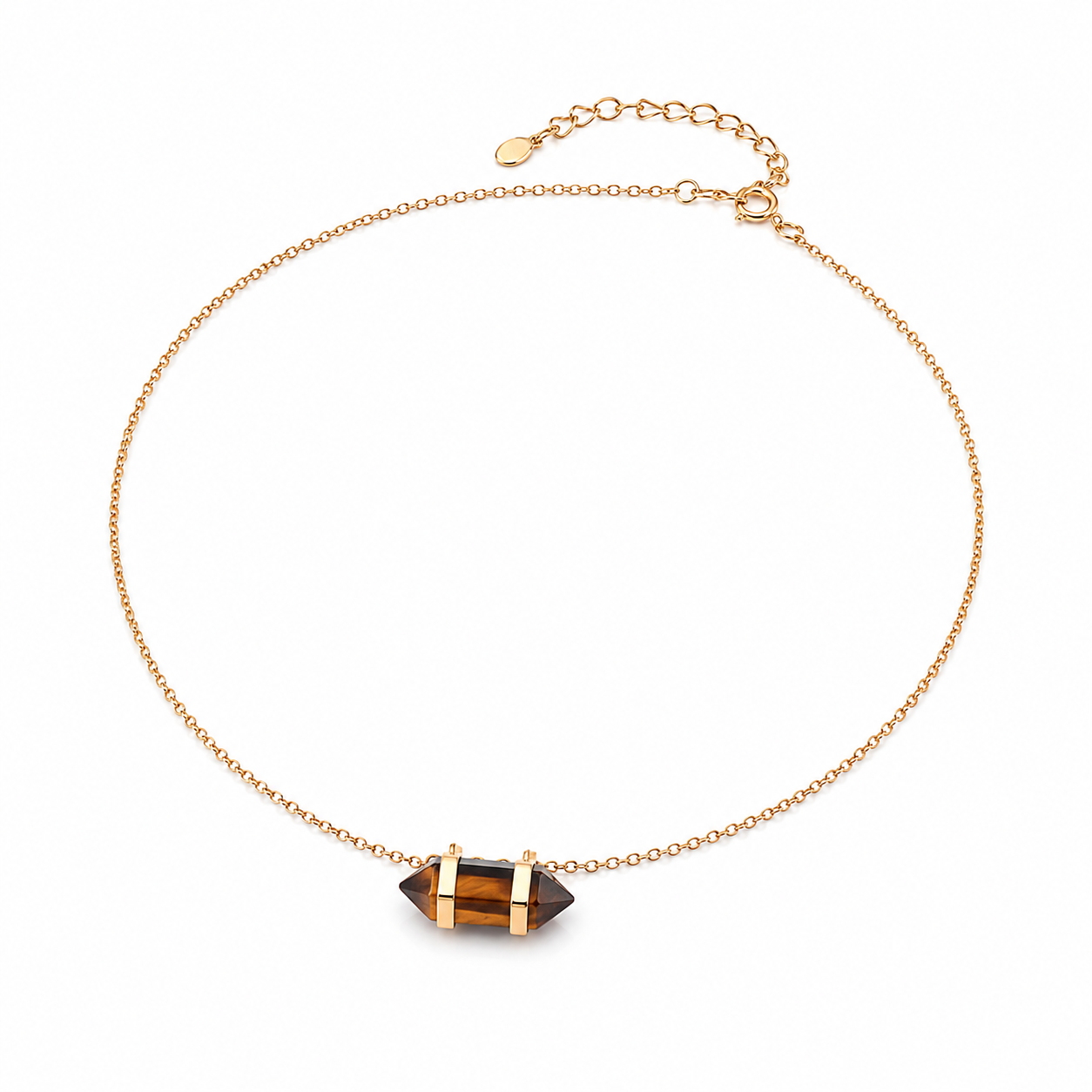 Gold chain necklace with centered dark geometric stone pendant