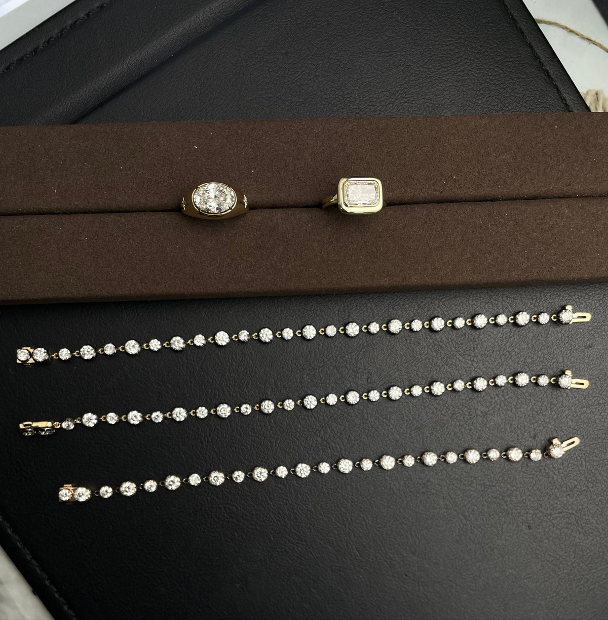 Gold-tone diamond tennis bracelet with round stones and box clasp