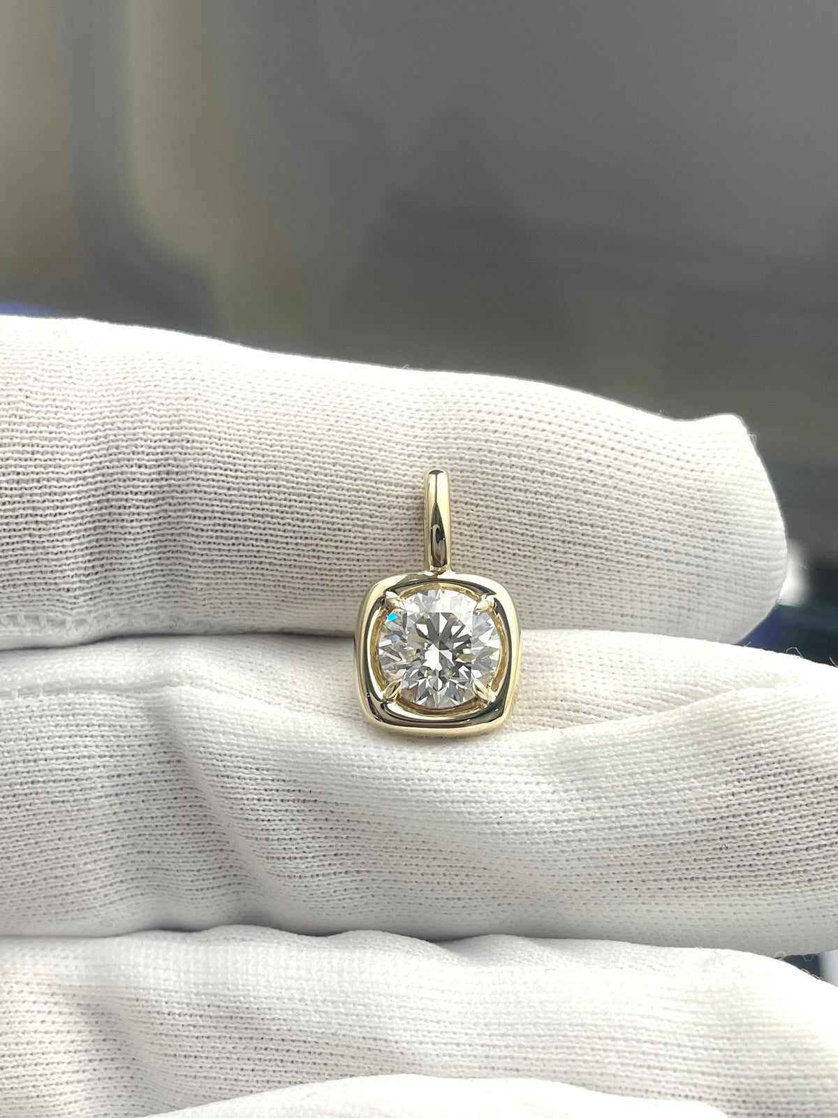 Round lab diamond pendant in gold tone with bezel-set center