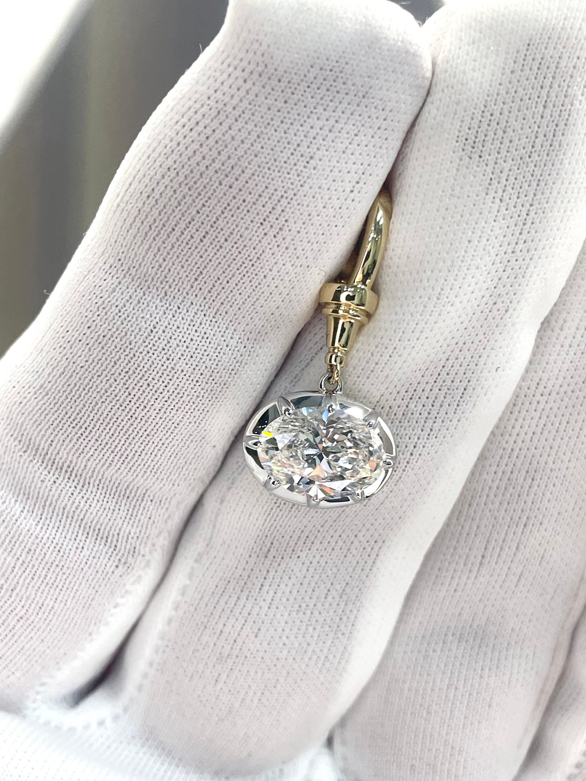 Gold-tone hoop drop earring with round clear crystal cluster