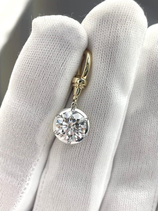 Gold-toned round lab diamond pendant with small hoop bail