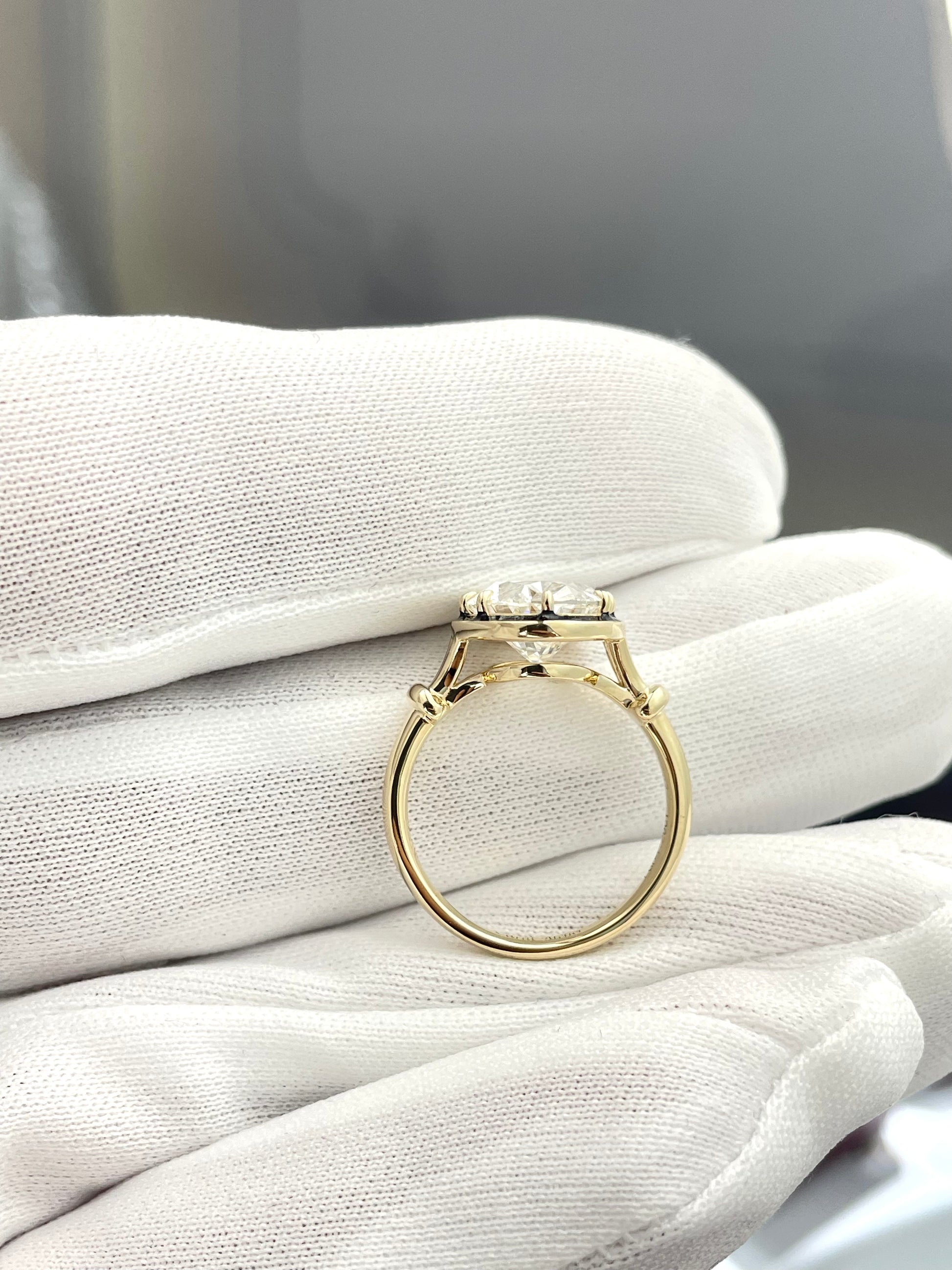 Oval lab diamond ring, prong-set center with halo detail, openwork band
