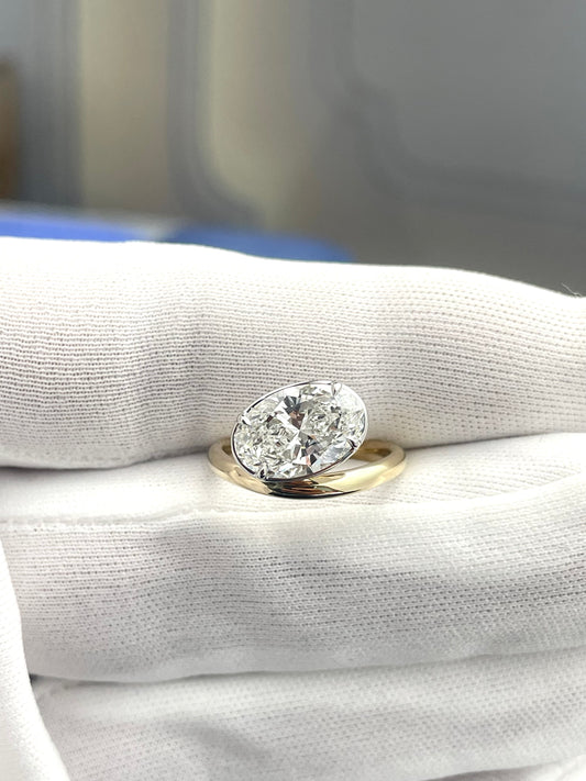 Floating oval lab-grown diamond ring, yellow gold with large oval solitaire top view